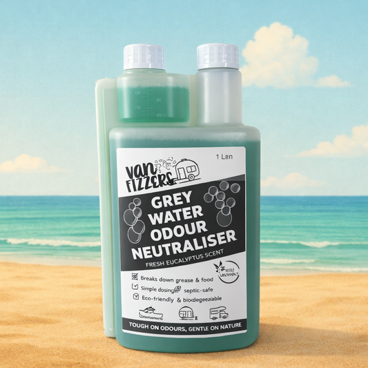 Van Fizzers Grey Water Odour Neutraliser bottle with a beach background